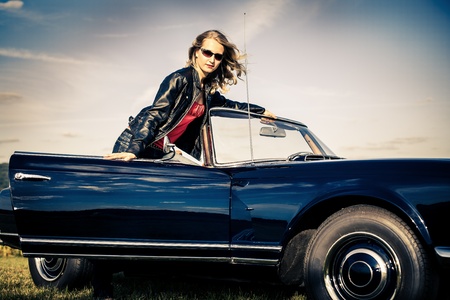 Young Girl at a Post-War Classic carの写真素材