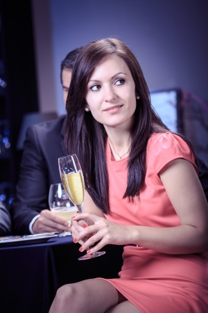 a young woman at table in a restaurantの写真素材