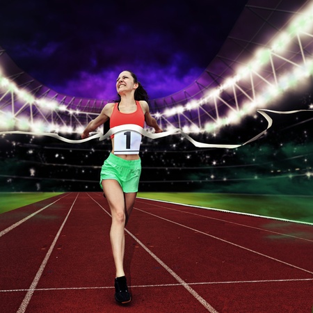 female athletic sportswoman on a track in the stadium