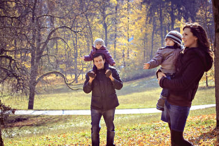 portrait of a young family in the autumn parkの写真素材