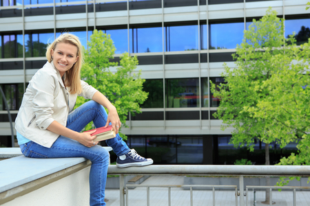 portrait of a young woman in a townの写真素材