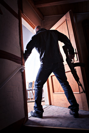 masked militant with a kalashnikov submachine gunの写真素材
