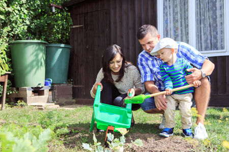 little boy working in the garden