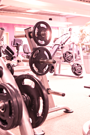 diverse equipment and machines at the gym roomの写真素材