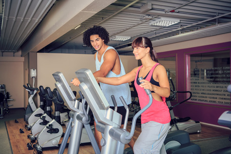 sportspeople at workout in a gym