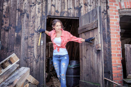 portrait of a young woman in the old barnの写真素材
