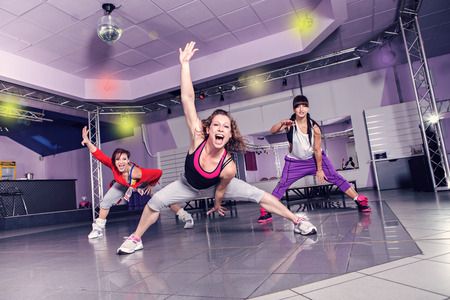 group of women in sport dress at fitness dance exercise or aerobicsの写真素材