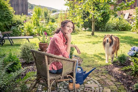 portrait of a young woman in the gardenの写真素材