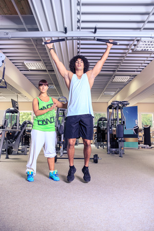 sportspeople at workout in a gymの写真素材