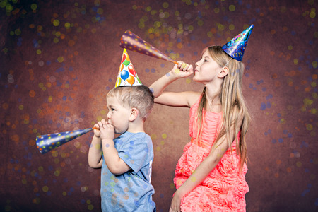 siblings celebrating the birthday partyの写真素材