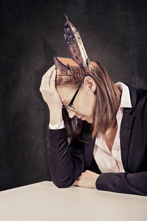portrait of a frustrated woman in the officeの写真素材