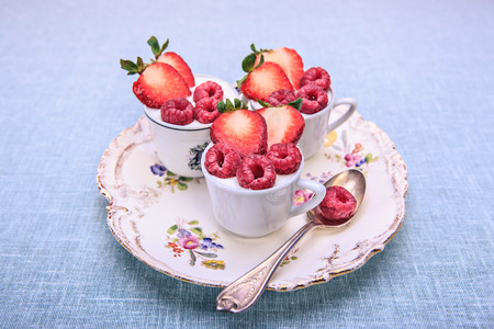 dessert with raspberries and strawberries in rural styleの写真素材