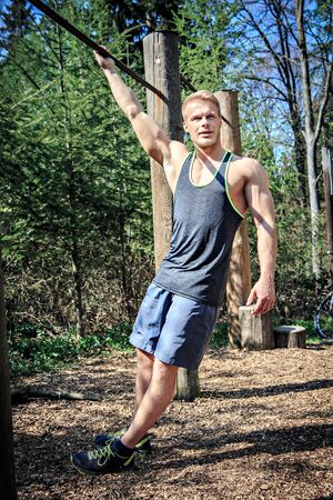young man at training on a fitness trail
