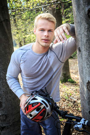 young man at training on a fitness trailの写真素材