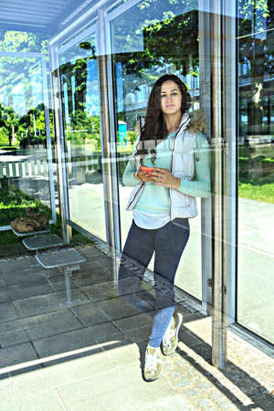 lifestyle portrait of a young woman in the city