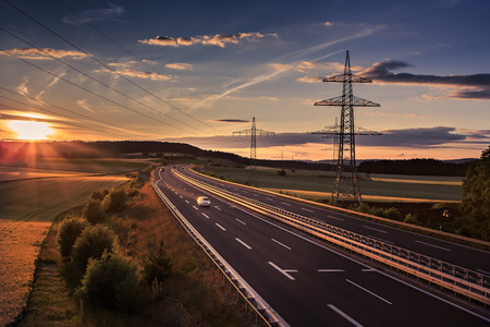 stretch of motorway in Germany by setting sun