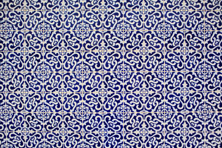 textured surface of old and cracked ceramic tiles from Portugalの写真素材