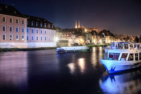 Regnitz river view of Bamberg Town by night, Bavaria, Germanyの写真素材