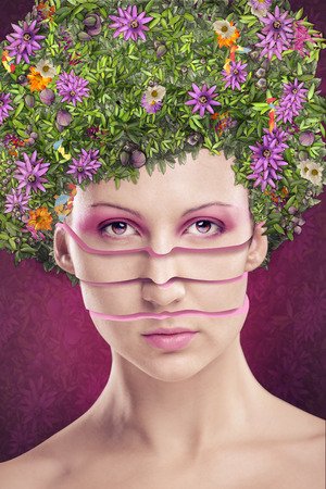 studio portrait of a young woman with an extreme hairstyle and make upの写真素材