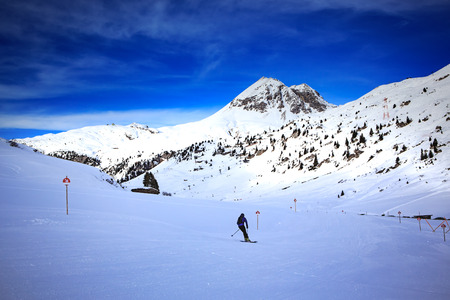 A ski driver on the piste in Alps by Lech, Austria.