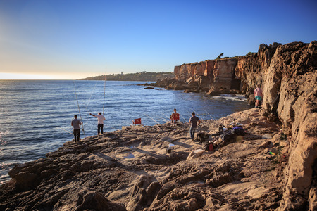CASCAIS, PORTUGAL - CIRCA OCTOBER, 2016: The anglers at Boca do Inferno cave in Cascais, Portugalのeditorial素材