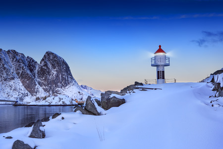 A lighthouse in Reine on Lofoten Islands by sunset, Norwayの写真素材