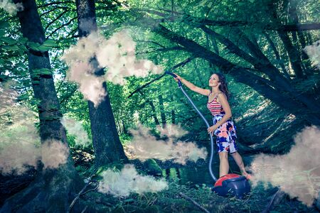 symbolic picture with a young woman at the ecological cleaningの写真素材