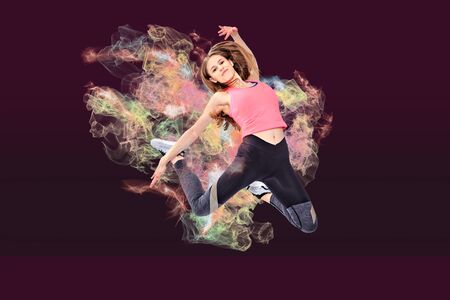 a young girl in sport dress by dancing aerobics or fitness exerciseの写真素材