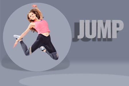 a young girl in sport dress by dancing aerobics or fitness exerciseの写真素材