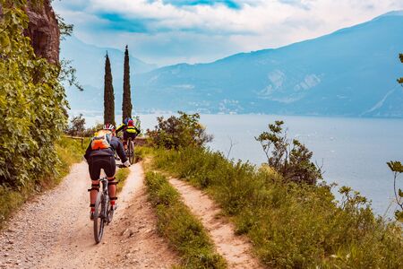 Group of biker in front of Garda lake in Italy
