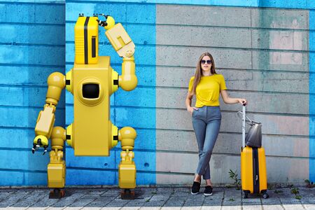 Symbolic picture for traveling with a robot by train. A teenage girl with suitcases and a robot on...