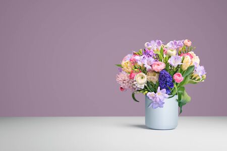 the still life of a bunch of freesias, tulips, ranunculus and hyacinthsの写真素材