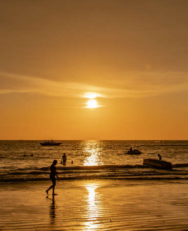 walking on sunset beachの写真素材