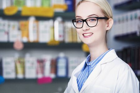 young woman pharmacist smilingの写真素材