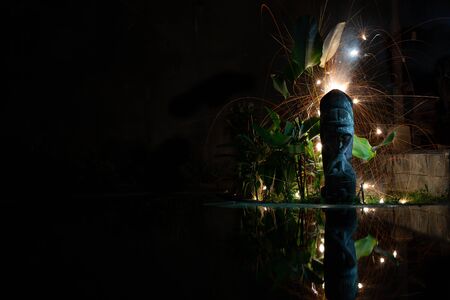 Silhouet of kiss under firework with reflectionの写真素材