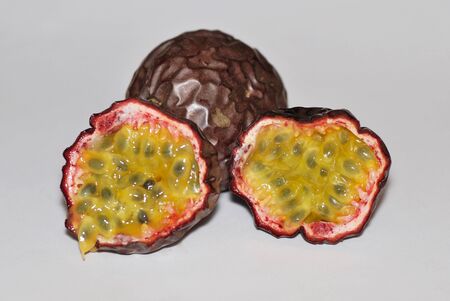 juicy ripe passion fruit cut in halfの写真素材