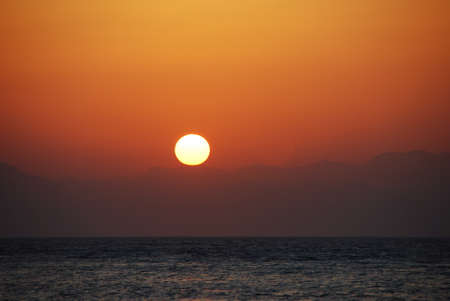 warm beautiful romatischer sunrise on the seaの写真素材