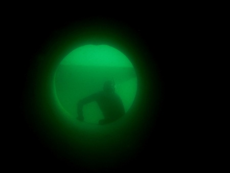 apnea diver or free diver looking through a long tube in the lakeの写真素材