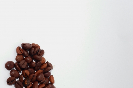 fresh coffee beans on white background view bottom leftの写真素材