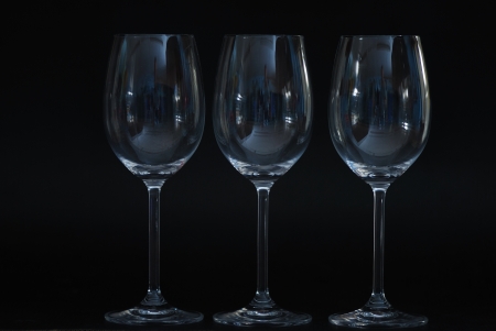 three empty glasses of wine on black background normalの写真素材