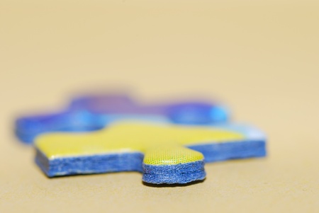 puzzle piece in big close-up macro horizontal format with soft backgroundの写真素材