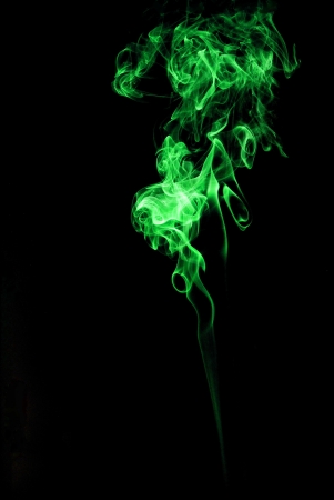 green smoke on black backgroundの写真素材