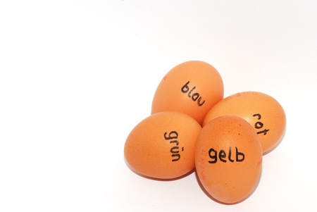 four german labeled eggs for easter on white backgroundの写真素材