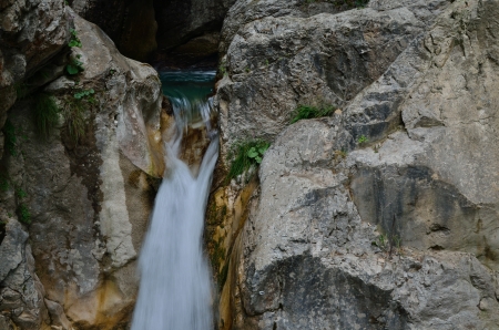 waterfall in wild gray rock the mountainsの写真素材