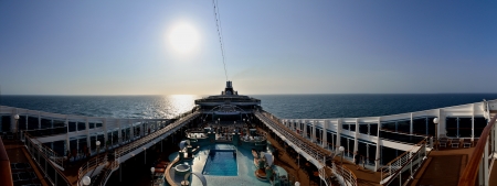 big cruise ship with open deck panorama