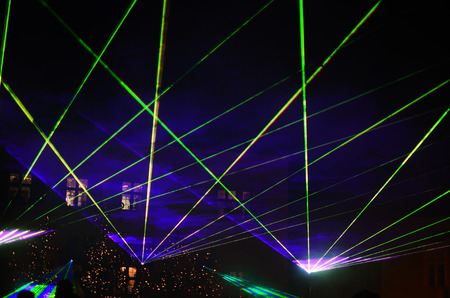 beautiful laser show with green glow in the nightの写真素材