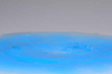 small drops in blue liquid