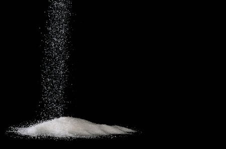 sugar sprinkle on black backgroundの写真素材