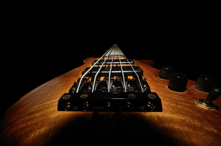 bass guitar from behind with black background