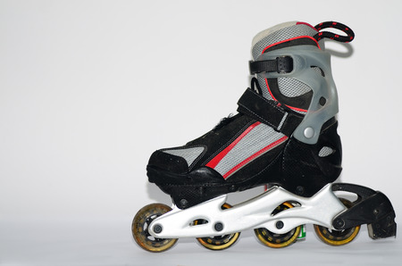 rollerskates for men in gray and red on a white backgroundの写真素材